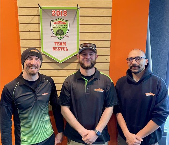 Three SERVPRO restoration technicians standing at the office 