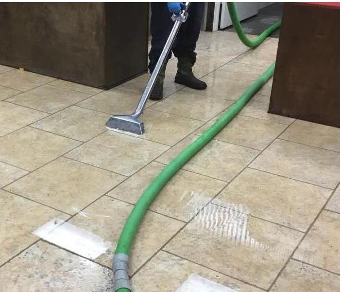 water on tile floor