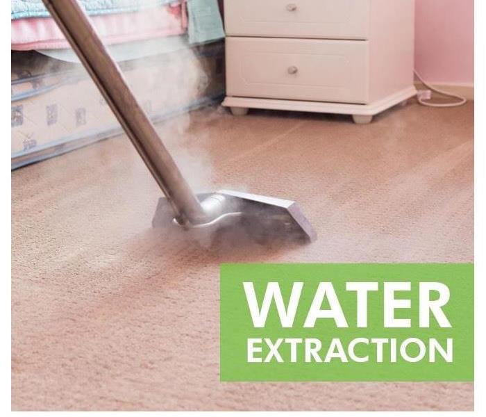 Extractor equipment extracting water from carpet flooring