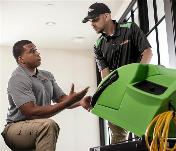 Image of SERVPRO employees working together